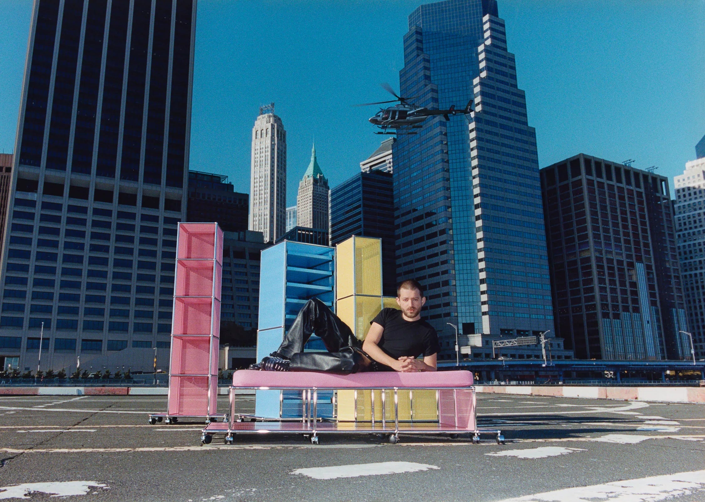 Ben Ganz with USM NYC pieces in front of the NYC skyline (image via Rarify)